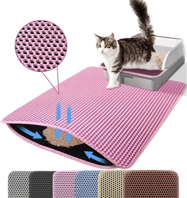 Pink cat litter mat with a cat sitting on it, showing its texture and design.