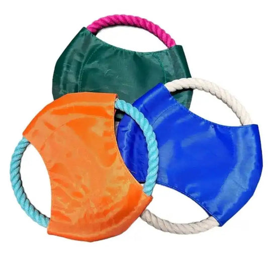 Three colorful dog toys with ropes on a white background